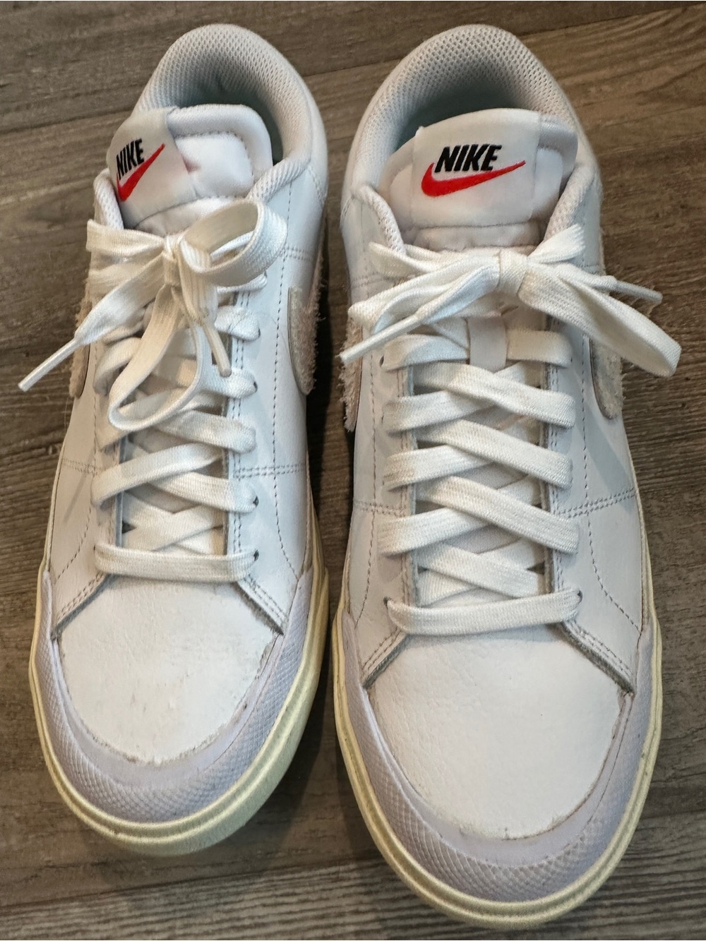 Nike women’s White Low-Top Sneakers with Red Swoosh